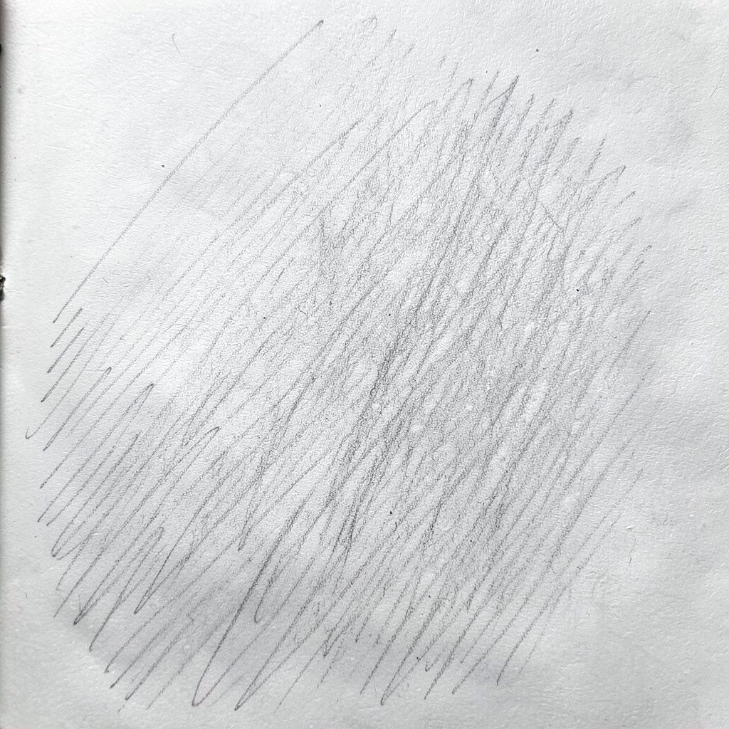 Graphite pencil sketch of folded women's athletic shirts stacked neatly, drawn in gray and charcoal shading with gentle shadows